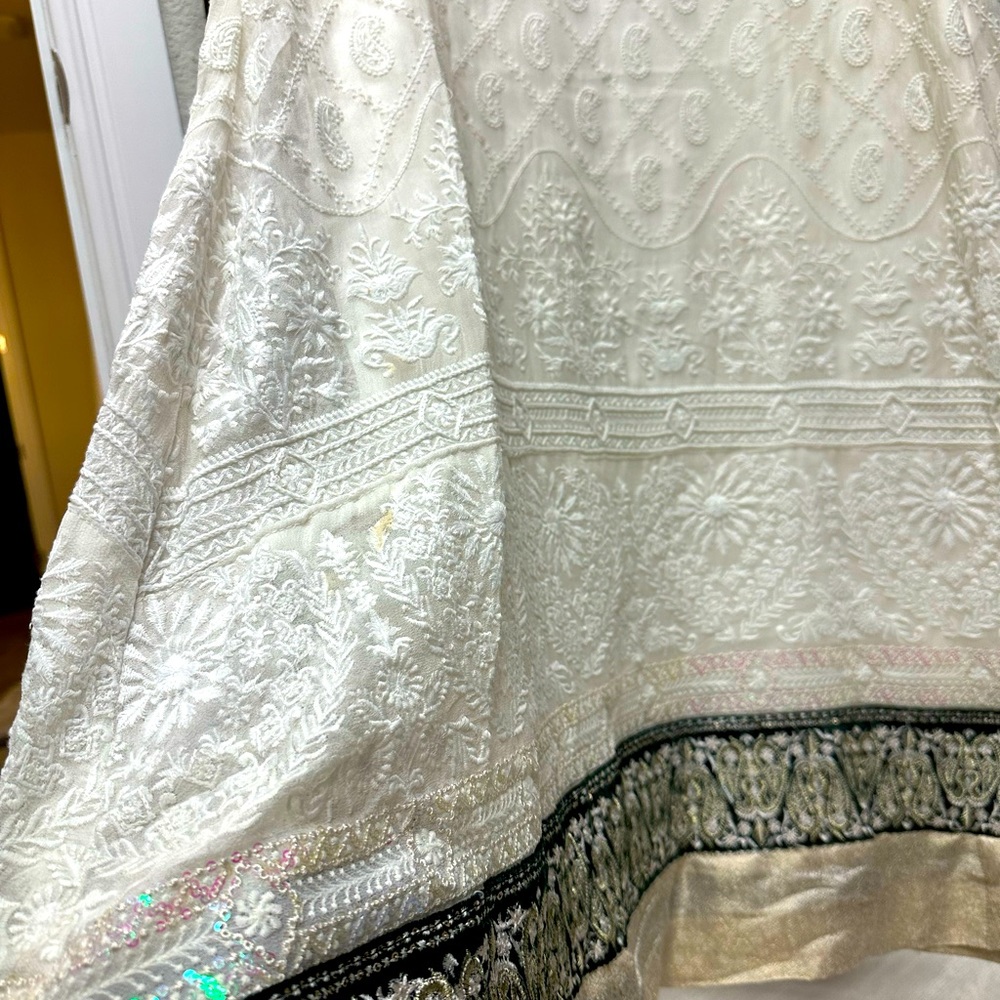 Thread and motifs shirt and dupatta . All embroidered.